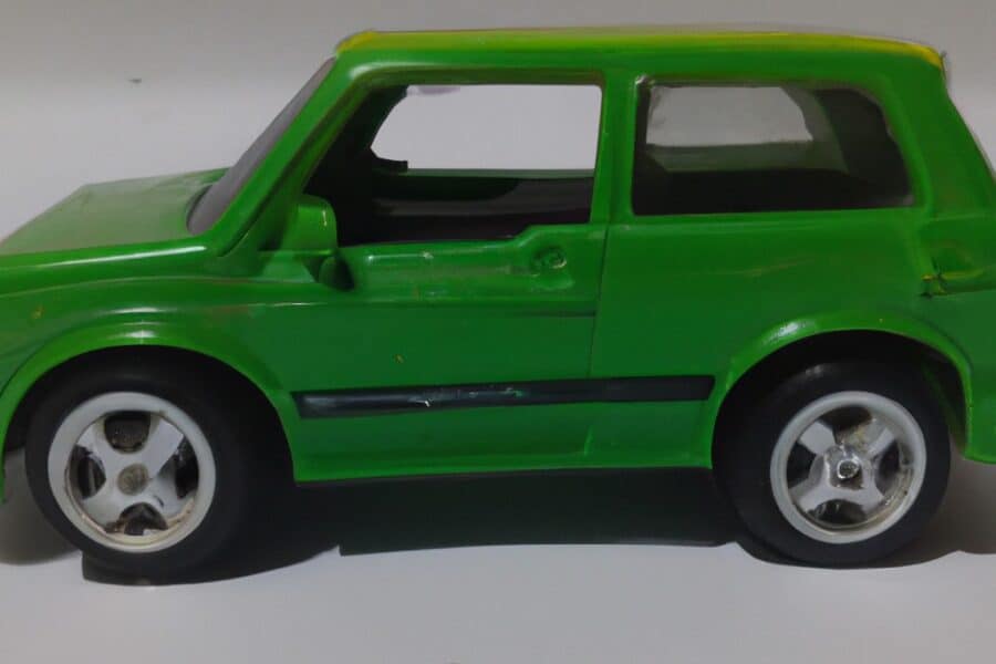 Compact green car side view